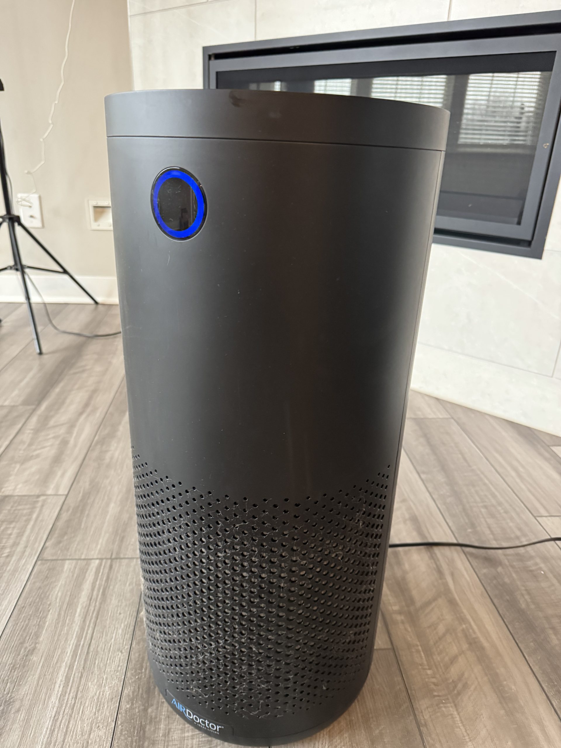 AirDoctor 4000 review front view showing air quality sensor ring in living room setting