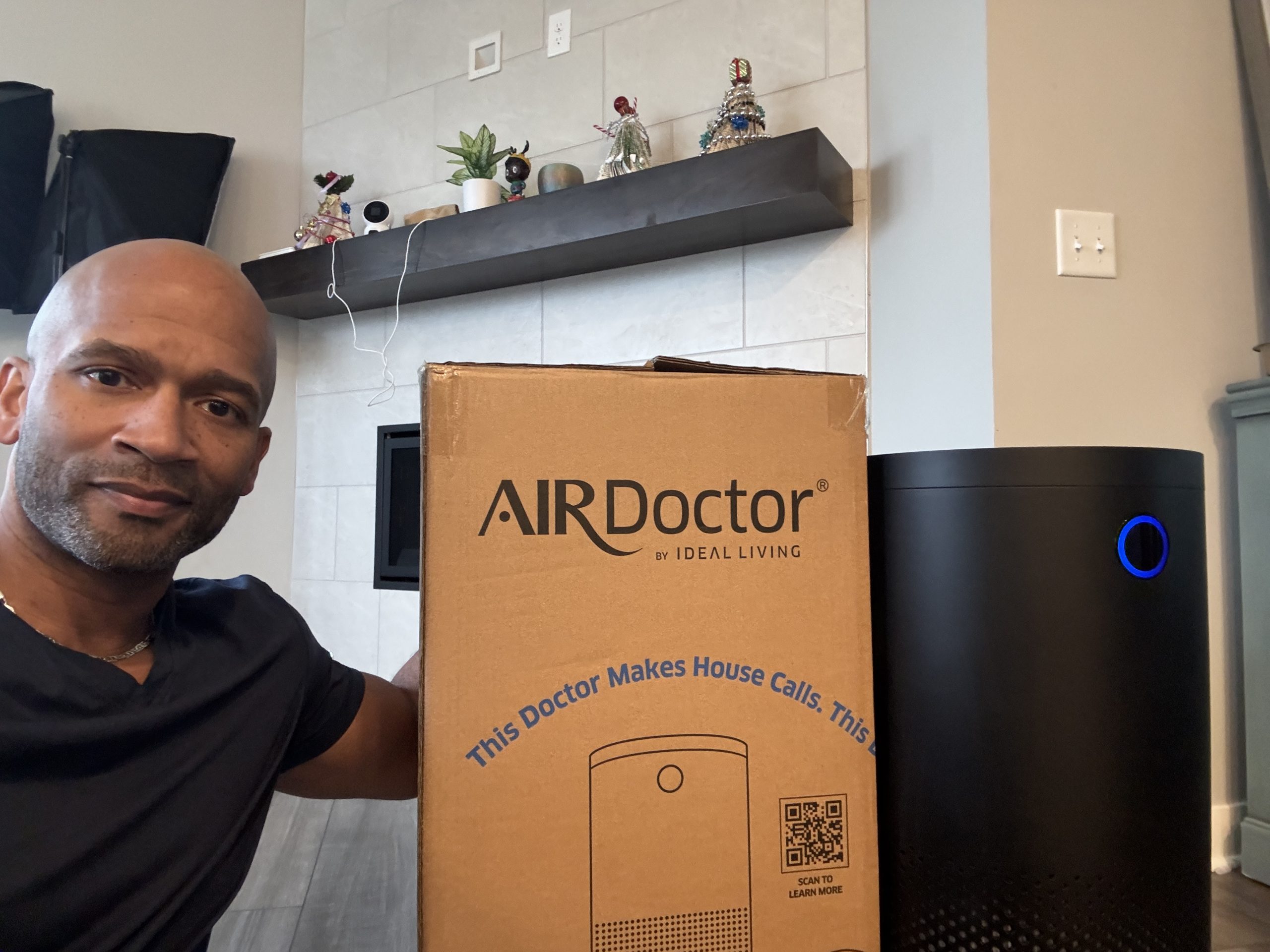 Man reviewing AirDoctor 4000 air purifier at home for allergy relief