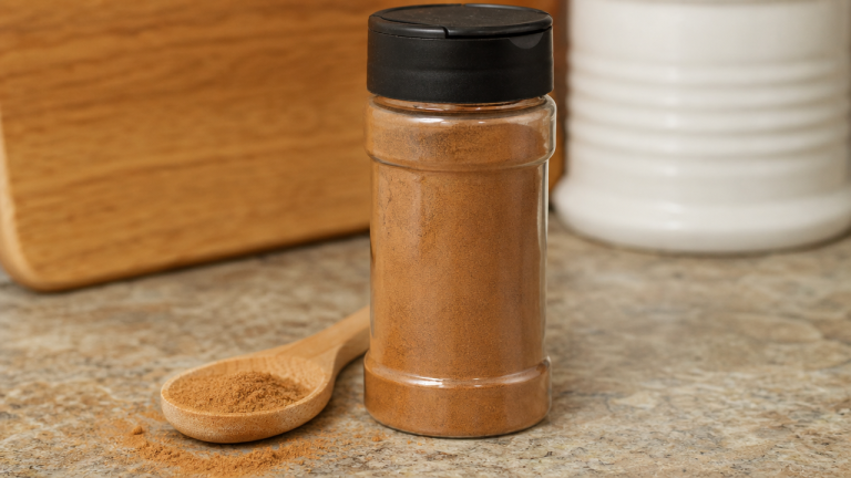 Container of ground cinnamon on a kitchen counter, similar to the recalled Lior brand product